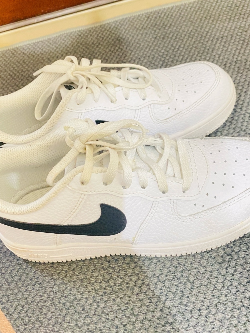 Nike Kids White Sneakers with Black Swoosh